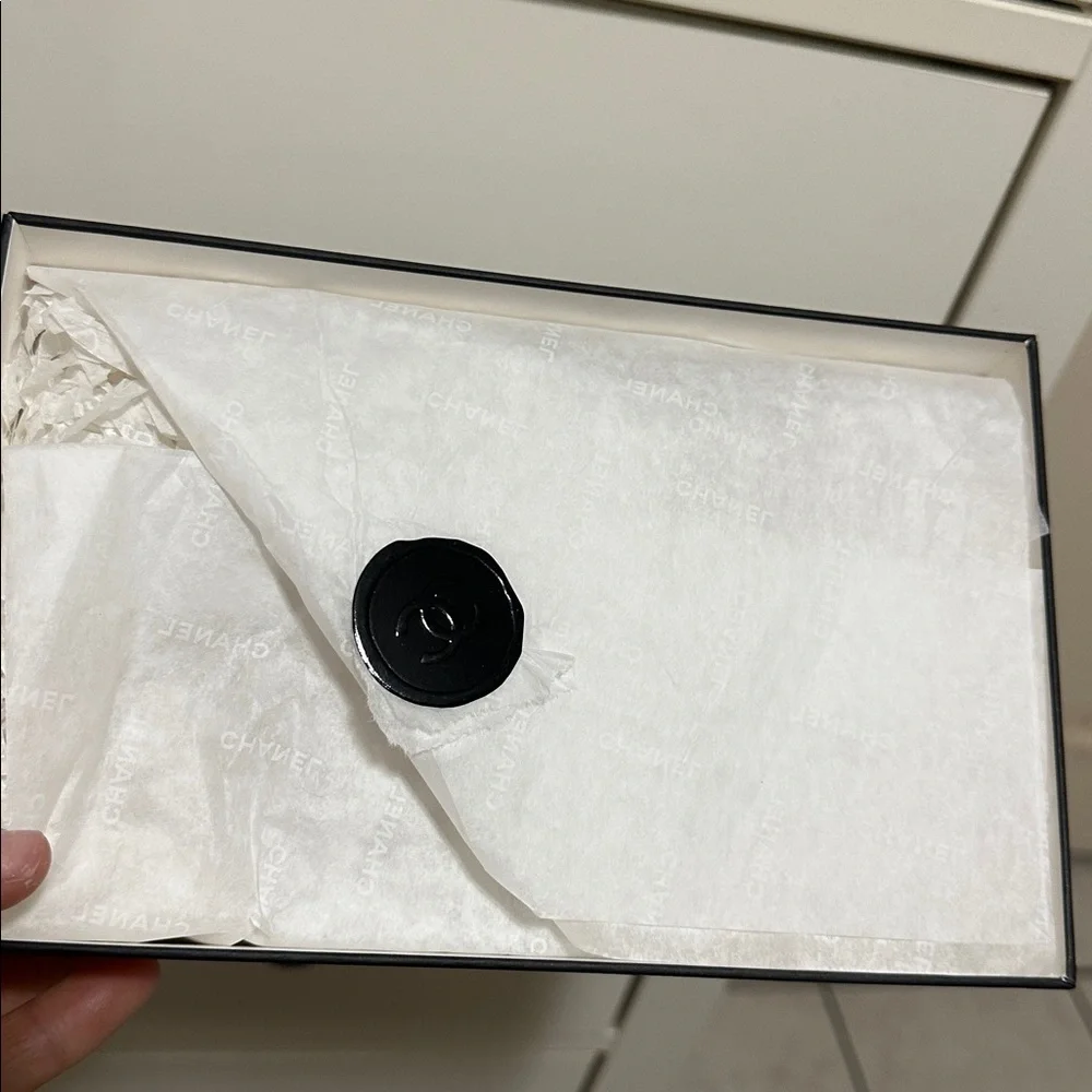 CHANEL Elegant White Box with Black Accents.03/12/2026